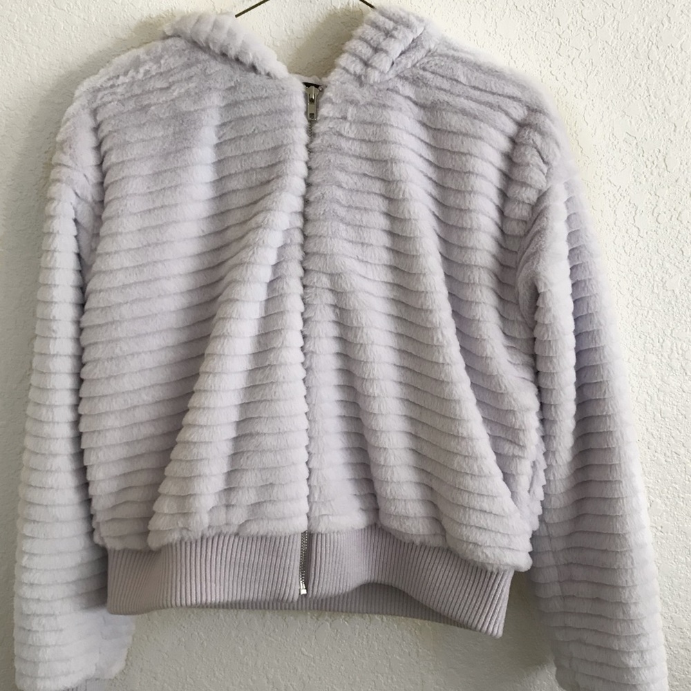 Light violet fluffy coat.